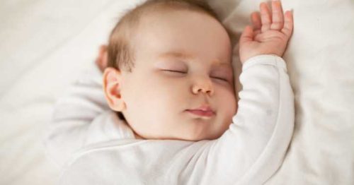 Infant sleeping on their back.