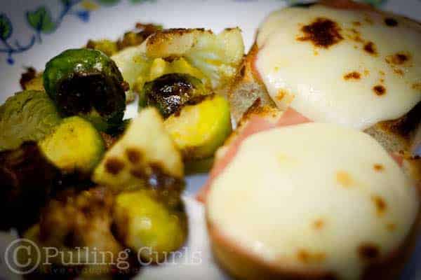 Croque Monsieur with roasted veggies from gathered table.