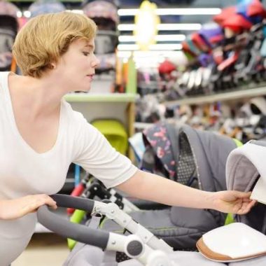 mom looking at strollers