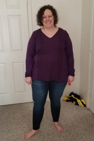 purple shirt and jeans