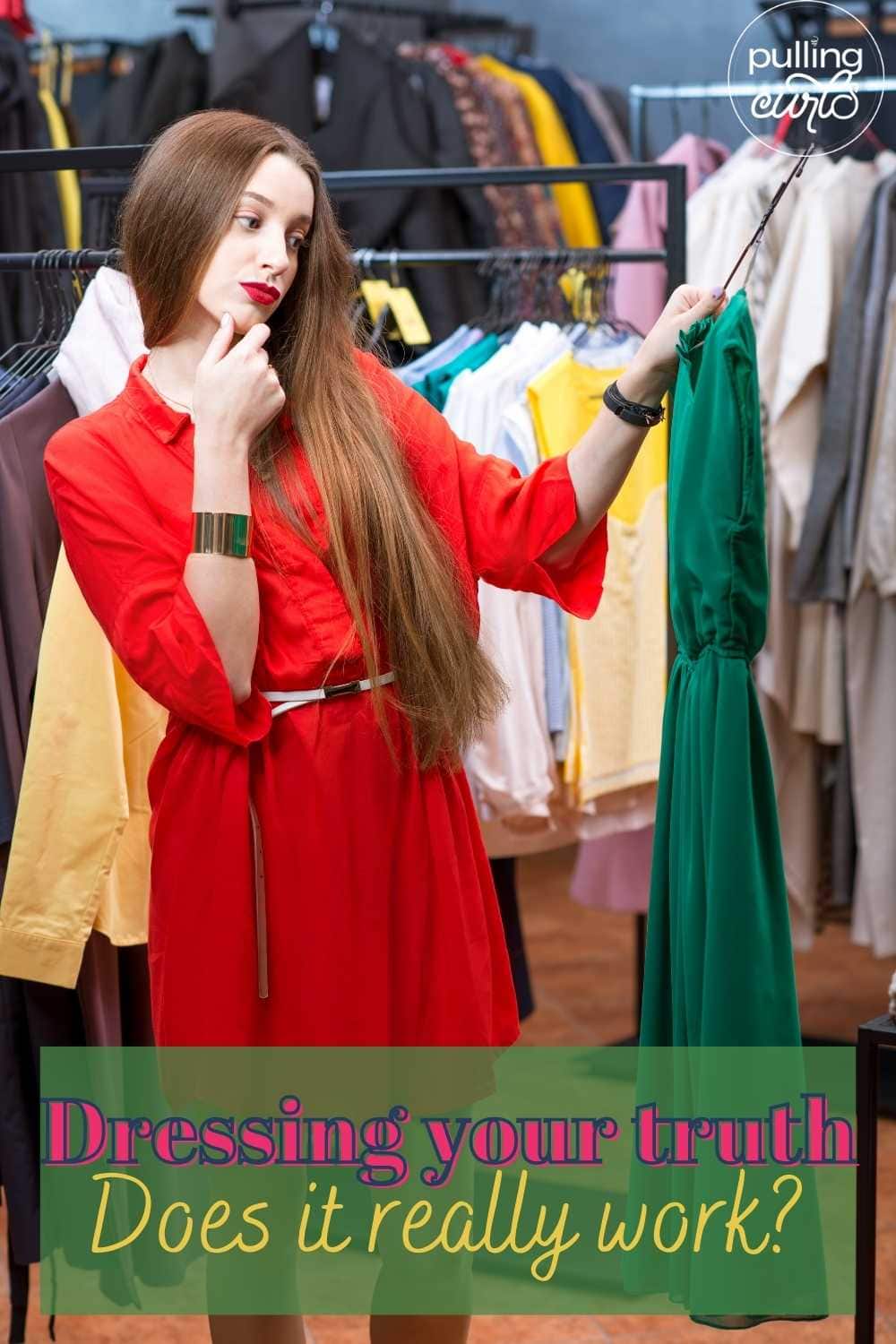 Woman in red dress shopping, holding a green dress. via @pullingcurls