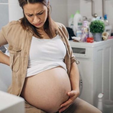 pregnant woman on toilet