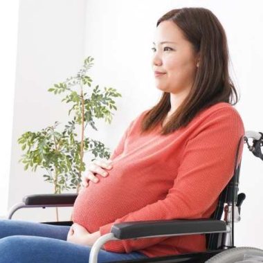 pregnant woman in a wheelchair