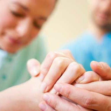 man and woman holding hands during labor