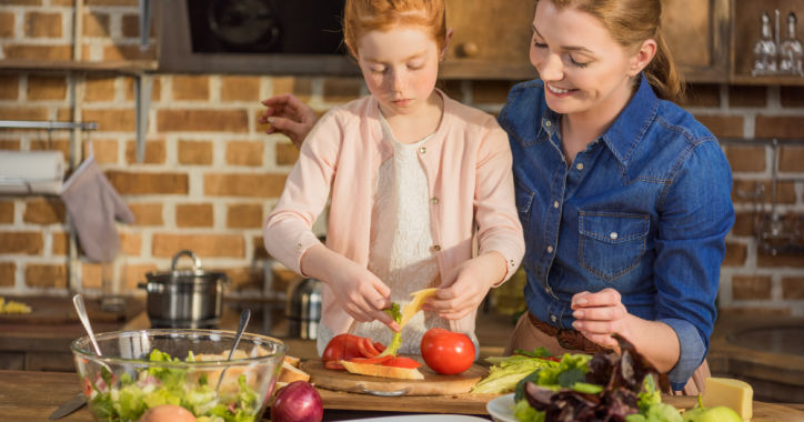 Mom and daughter making dinner