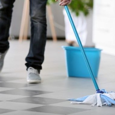 tile floor being cleaned with a mop