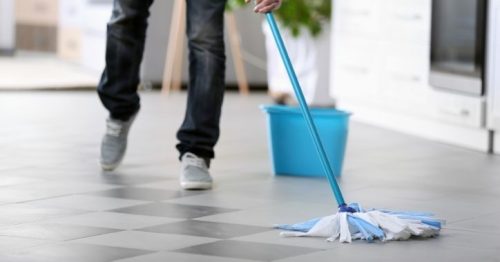 tile floor being cleaned with a mop