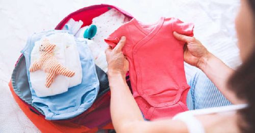 woman packing hospital bag