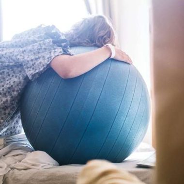 pregnant woman on a labor ball