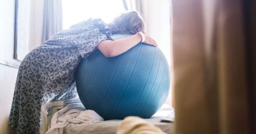 pregnant woman on a labor ball