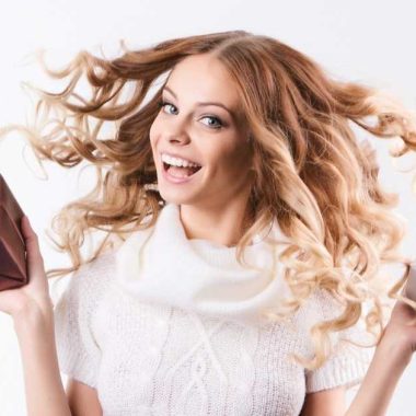 Happy woman holding two presents