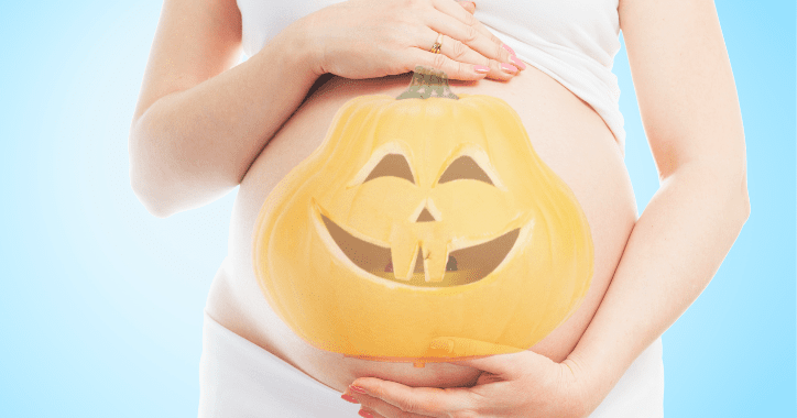Pregnant belly with Jack-o-Lantern face.
