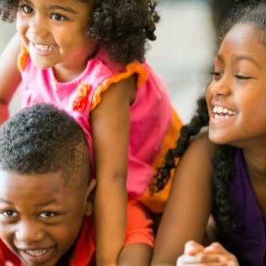 three siblings playing together