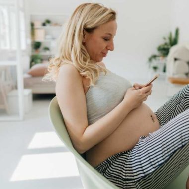 pregnant woman on her phone