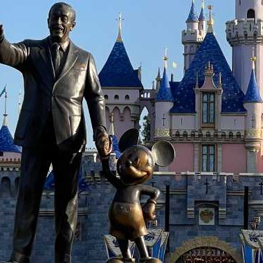 Partners statue of Walt Disney and Mickey Mouse in front of Sleeping Beauty Castle in Disneyland