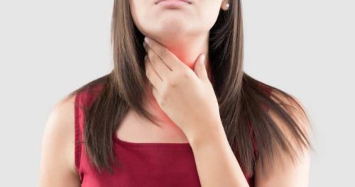 woman wiht a sore throat