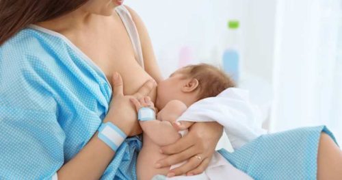woman breastfeeding in the hospital after birth