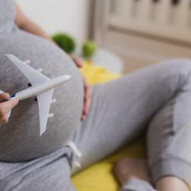 pregnant woman with plane on belly.