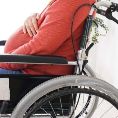 pregnant woman in a wheelchair