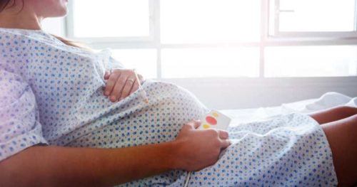 pregnant woman in a hospital bed