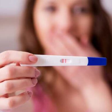 woman with a positive pregnancy test