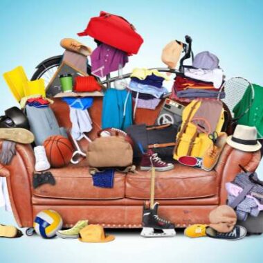 a bunch of stuff piled on a couch.