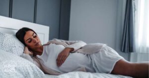 pregnant woman with her hand on her belly