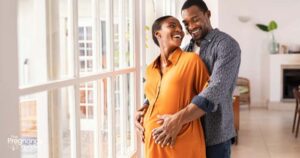 pregnant couple laughing