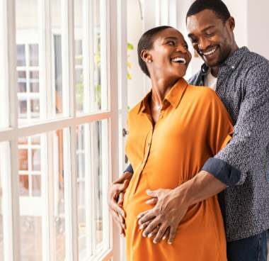 pregnant couple laughing